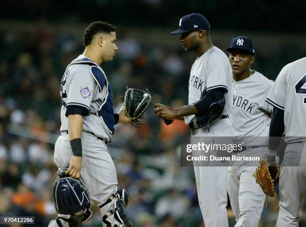 Catcher Gary Sanchez of the New York Yankees visits pitcher Domingo German of the New York Yankees during game two of a doubleheader at Comerica Park...