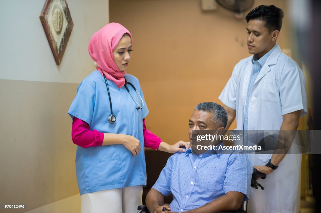 Female Muslim Doctor consulting with a patient