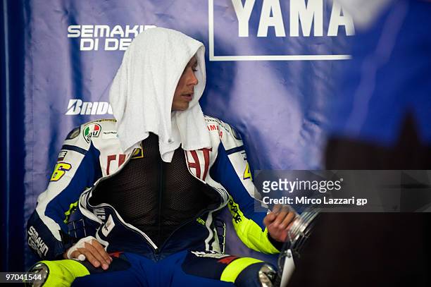 Valentino Rossi of Italy and Fiat Yamaha Team looks on in box during the first day of MotoGP test at Sepang Circuit on February 25, 2010 in Kuala...