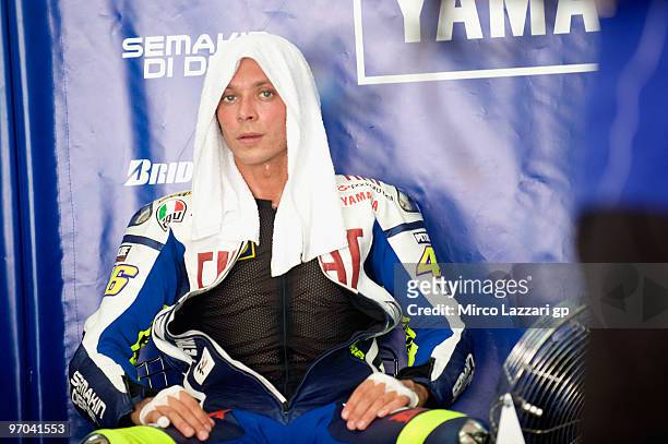 Valentino Rossi of Italy and Fiat Yamaha Team looks on in box during the first day of MotoGP testing at Sepang Circuit on February 25, 2010 in Kuala...