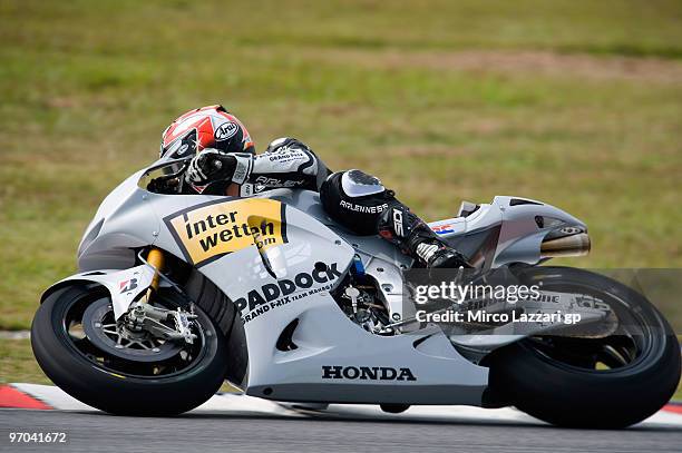 Hiroshi Aoyama of Japan and Interwetten MotoGP Team rounds the bend during the first day of MotoGP testing at Sepang Circuit on February 25, 2010 in...