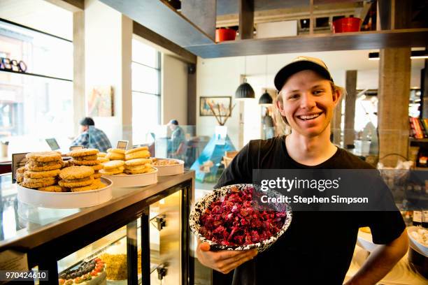 worker holding salad bowl in cafe in montana - mt cook fotografías e imágenes de stock