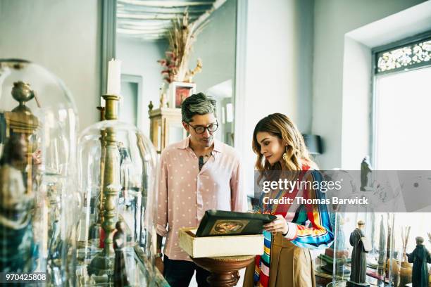 couple looking at display in small museum while on vacation - museum tour stock pictures, royalty-free photos & images