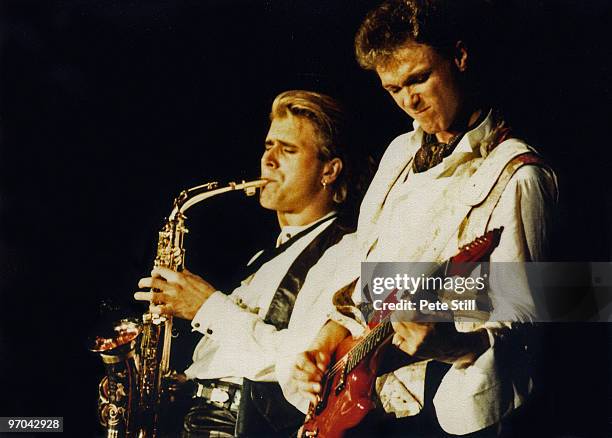 Steve Norman and Gary Kemp of Spandau Ballet perform on stage on the 'Parade' tour at Wembley Arena on December 8th, 1984 in London, England.