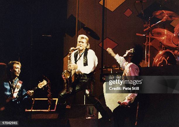 Martin Kemp, Steve Norman and Tony Hadley of Spandau Ballet perform on stage on the 'Parade' tour at Wembley Arena on December 8th, 1984 in London,...