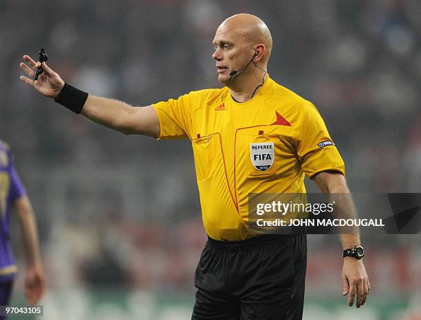 Referee Tom Henning Ovrebo of Norway gestures towards players during the Bayern Munich vs ACF Fiorentina Champions League round of 16 football match...