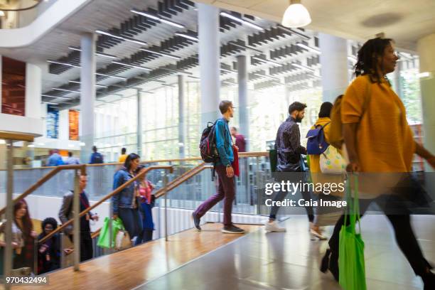 Business people ascending stairs at conference