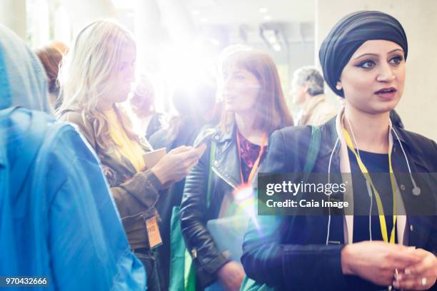 Businesswomen talking at conference