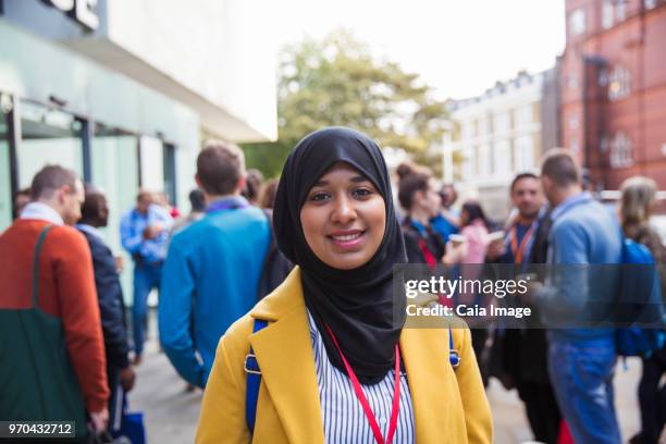 Portrait smiling, confident businesswoman in hijab on street