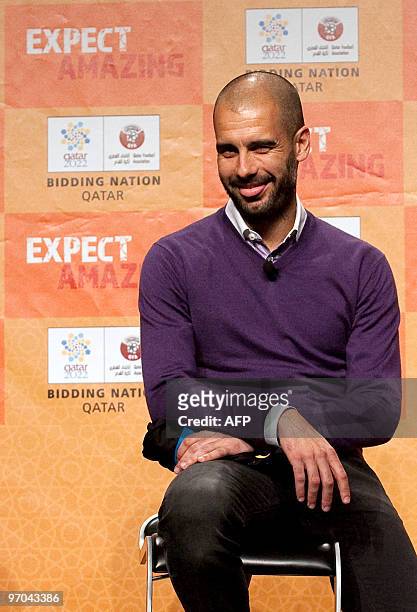 Coach of Barcelona's soccer team Pep Guardiola poses for photographer after announcing his support for Qatar's bid to host the football World Cup in...