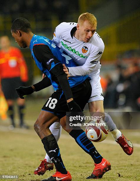 Valencia FC's Jeremy Mathieu vies for the ball with Club Bruges's Ryan Donck during their UEFA Europa League first leg round 32 football match in...