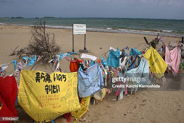 Banners hang on barbed wire on the coast of Henoko, near the US military base Camp Schwab and one of the possible relocation site of U.S. Air Base in...