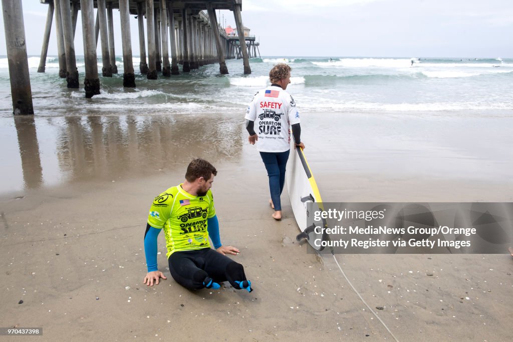 Wounded veterans get chance to surf during Operation Surf in Huntington Beach, CA