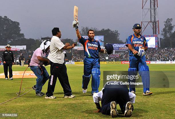 Sachin Tendulkar of India walks off the field and acknowledges the crowd as the first player in history to reach a double century in a one day...