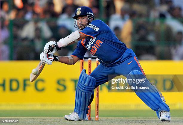 Sachin Tendulkar of India square cuts on his way to a record double century during the 2nd ODI between India and South Africa at Captain Roop Singh...