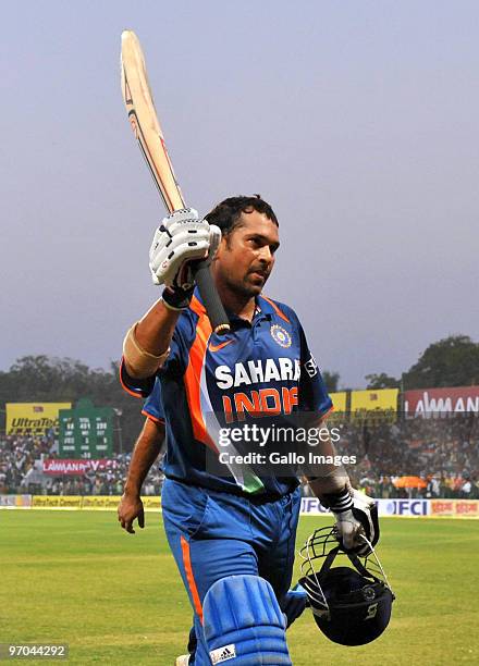 Sachin Tendulkar of India walks off the field and acknowledges the crowd as the first player in history to reach a double century in a one day...