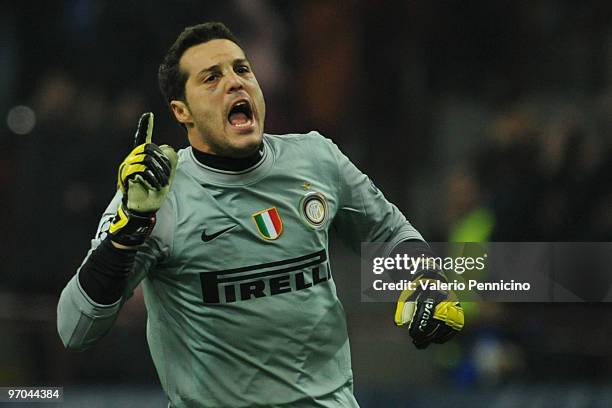 Julio Cesar of Inter Milan celebrates his team's first goal during the UEFA Champions League round of 16 first leg match between Inter Milan and...