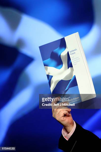 Alex Salmond, First Minister of Scotland holds up a copy of his government's draft referendum bill on independence on February 25, 2010 in Edinburgh,...