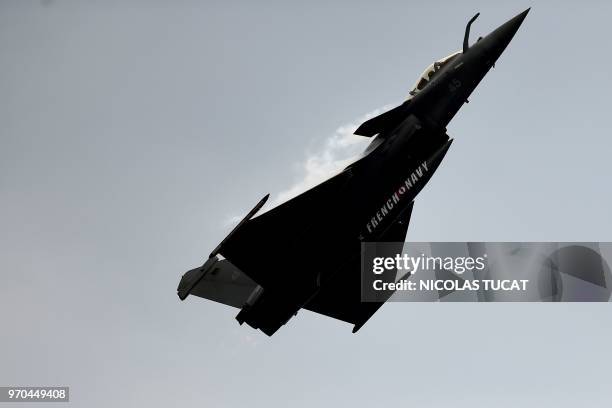 Rafale fighter jet of the French Navy performs during the International seaplane show in Biscarrosse, southwestern France, on June 9, 2018.