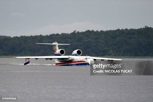 Beriev firefighting aircraft performs during the International seaplane show in Biscarrosse, southwestern France, on June 9, 2018.
