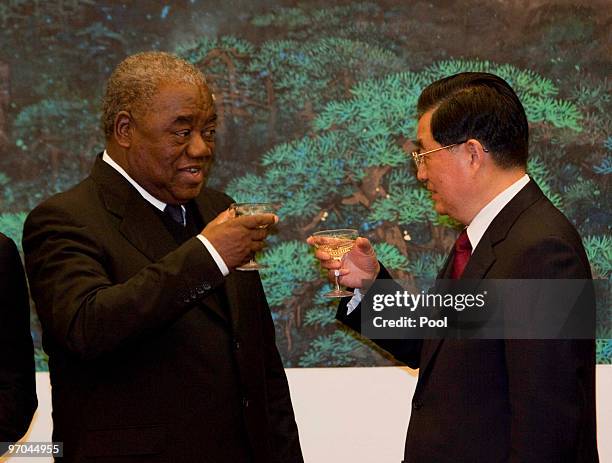 Zambian President Rupiah Bwezani Banda toasts with Chinese President Hu Jintao after a signing ceremony in the Great Hall of the People in Beijing,...