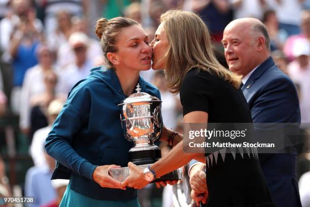 Arantxa Sanchez Vicario awards the winners trophy to Simona Halep of Romania following the ladies singles final against Sloane Stephens of The United...