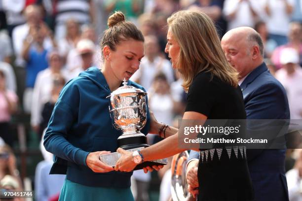 Arantxa Sanchez Vicario awards the winners trophy to Simona Halep of Romania following the ladies singles final against Sloane Stephens of The United...