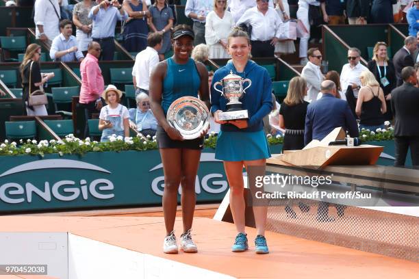 Losing Women Finalist Sloane Stephens and Winner of the Women Final Simona Halep acknowledge the applause of the audience after the Women Final of...