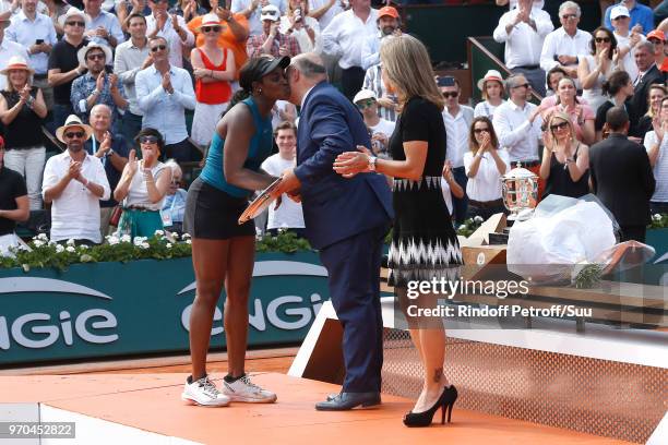 Losing Women Finalist Sloane Stephens, President of French Tennis Federation Bernard Giudicelli and Arantxa Sanchez Vicario stand on the court after...