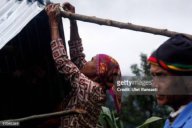Villagers make their temporary house as the search continues for people buried under a landslide on on February 25, 2010 in Dewata, West Java,...