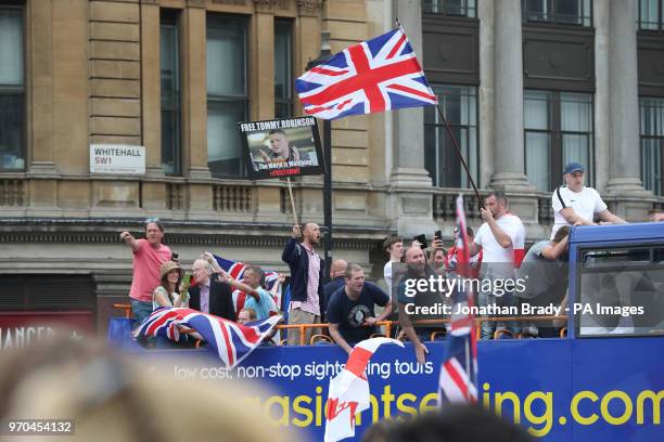 Supporters of Tommy Robinson on a open top bus during their protest in Trafalgar Square, London calling for his release from prison.