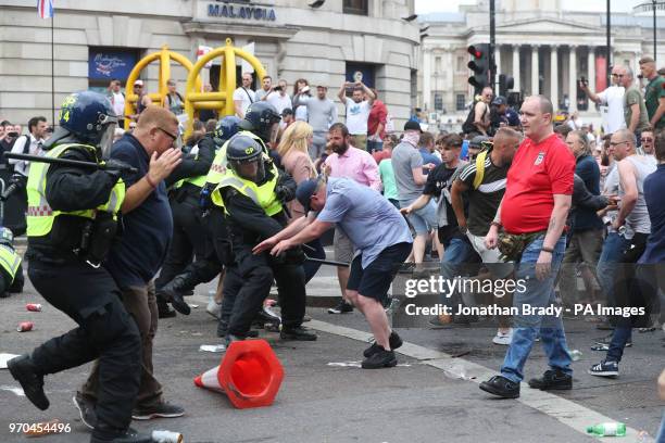 Police charge supporters of Tommy Robinson during their protest in Trafalgar Square, London calling for his release from prison.