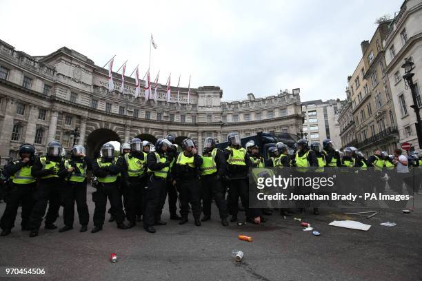 Police watch supporters of Tommy Robinson during their protest in Trafalgar Square, London calling for his release from prison.