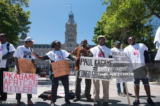 Protesters against Rwandan President Paul Kamage demonstrate outside the National Assembly of Quebec on June 9, 2019 in Quebec City, Canada, during...