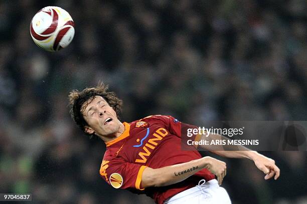 Roma's Rodrigo Taddei heads the ball during a round of 32, Europa League football game against Panathinaikos at the Athens Olympic staium on...