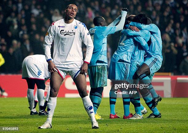 Copenhagens Mathias Zanka Joergensen pulls his shorts up in front of celebrating Olympique Marseille players during their Europa League round of 32...