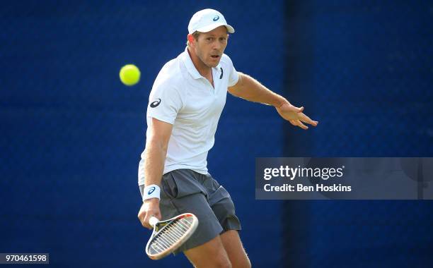 Brydan Klein of Great Britain hits a forehand during his qualifying match against Marcus WIllis of Great Britain Day One of the Nature Valley Open at...