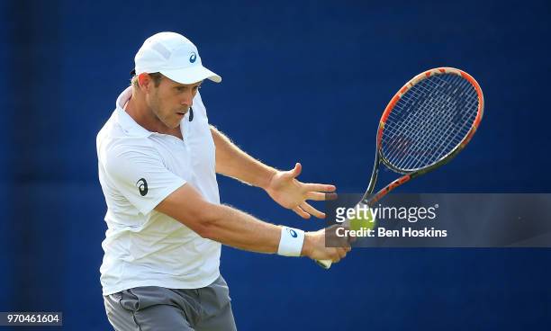 Brydan Klein of Great Britain hits a forehand during his qualifying match against Marcus WIllis of Great Britain Day One of the Nature Valley Open at...