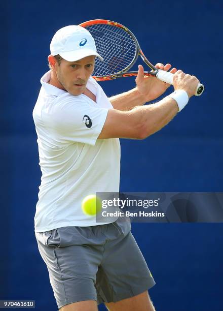 Brydan Klein of Great Britain hits a forehand during his qualifying match against Marcus WIllis of Great Britain Day One of the Nature Valley Open at...