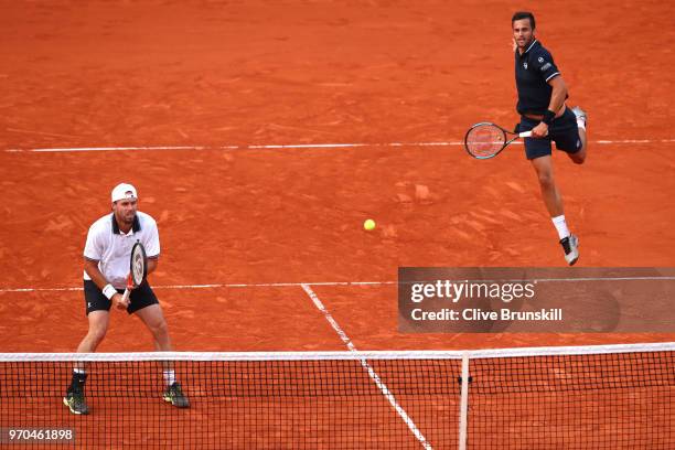 Mate Pavic of Croatia and Oliver Marach of Austria return the ball during the mens doubles final against Pierre-Hugues Herbert of France and Nicolas...