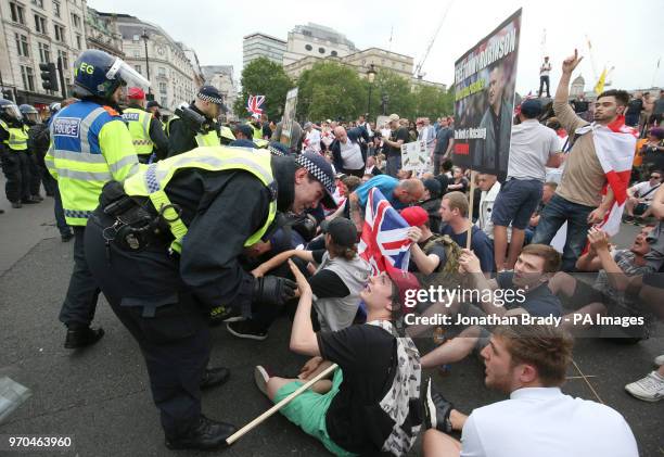 Police clear supporters of Tommy Robinson during their protest in Trafalgar Square, London calling for his release from prison.