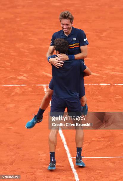 Pierre-Hugues Herbert of France and Nicolas Mahut of France celebrate victory following the mens doubles final against Oliver Marach of Austria and...