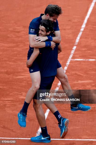 France's Pierre-Hugues Herbert and compatriot Nicolas Mahut celebrate after victory over Austria's Oliver Marach and Croatia's Mate Pavic, at the end...