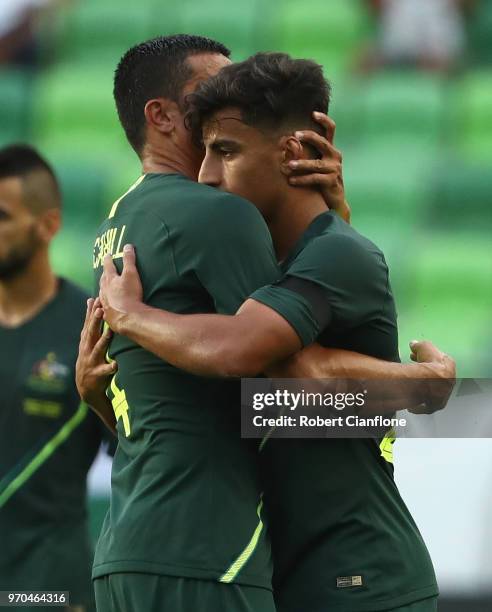 Tim Cahill of Australia and Daniel Arzani of Australia embarace after the International Friendly match between Hungary and Australia at Groupama...