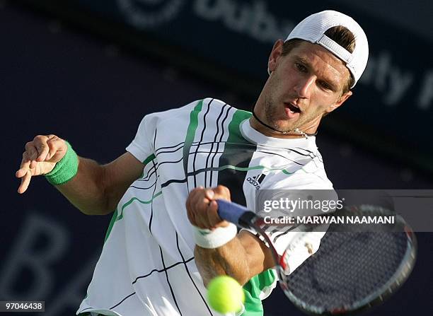 Austria's Jurgen Melzer returns to Marin Cilic of Croatia during their quarter-final match on the fourth day of the two-million-dollar ATP Dubai Open...