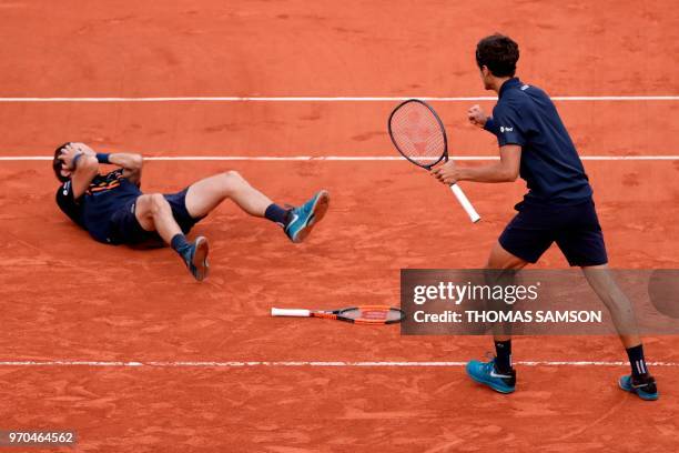 France's Pierre-Hugues Herbert and compatriot Nicolas Mahut celebrate after victory over Austria's Oliver Marach and Croatia's Mate Pavic, at the end...