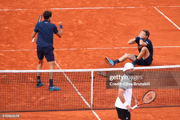 Pierre-Hugues Herbert of France and Nicolas Mahut of France celebrate victory following the mens doubles final against Oliver Marach of Austria and...