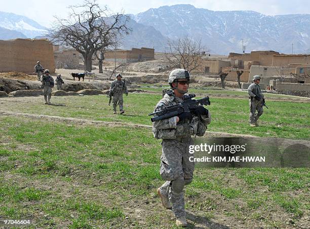 In this February 23, 2010 photograph, US soldiers with the 4th Infantry Division, 4th Infantry Brigade Combat Team, Alpha Company, patrol in...