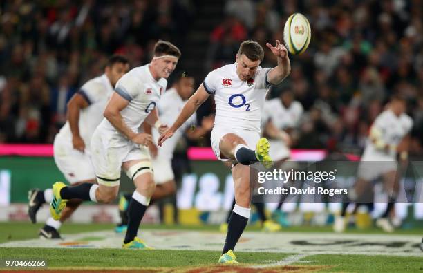 George Ford of England kicks the ball upfield during the first test match between South Africa and England at Elllis Park on June 9, 2018 in...