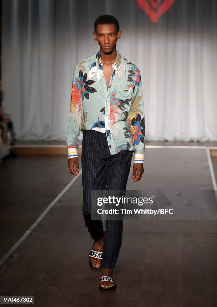 Model showcases a design at the Ben Sherman presentation during London Fashion Week Men's June 2018 at Middle Temple Hall on June 9, 2018 in London,...